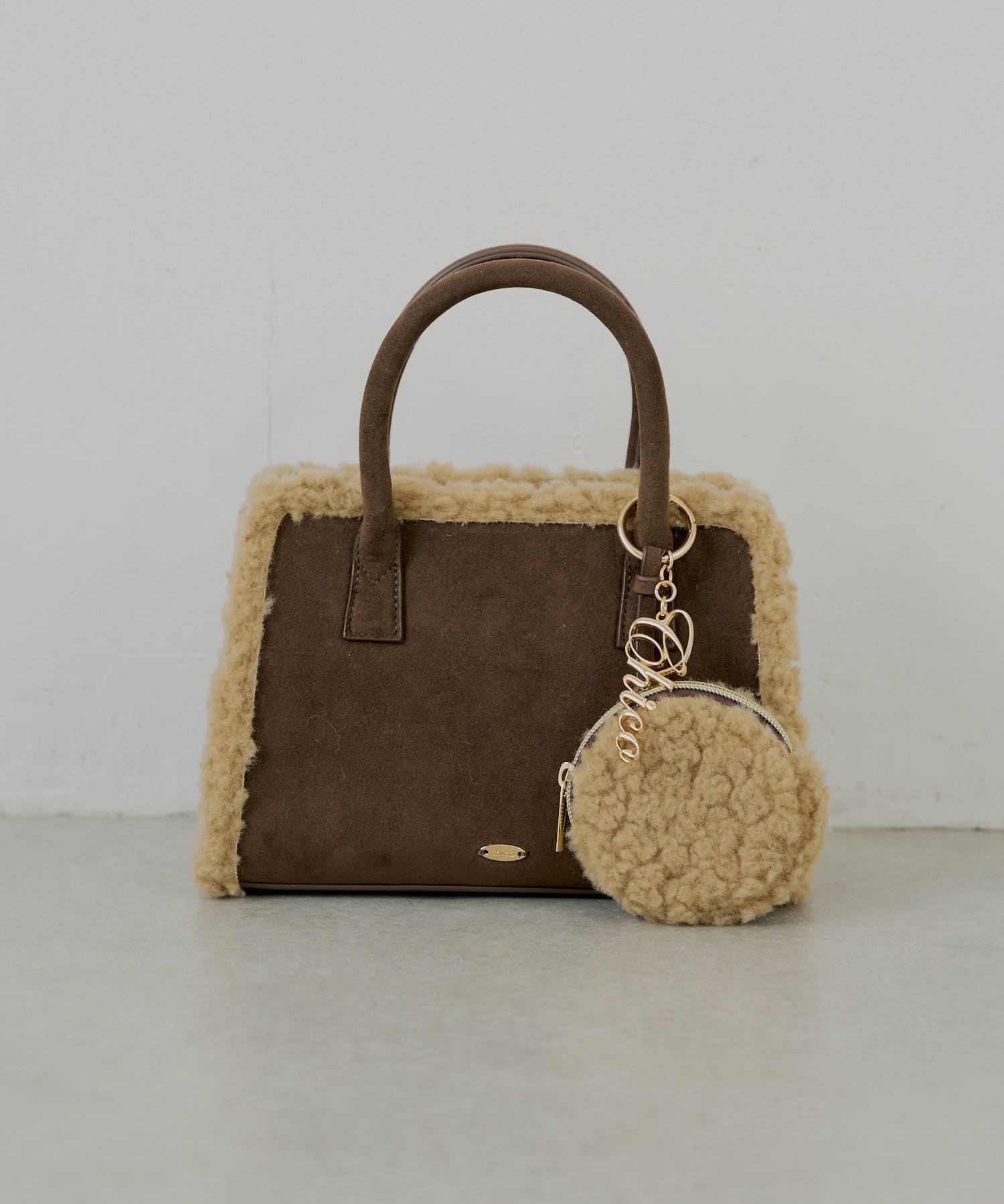 ロゴチャーム付きスエードムートンバッグ | Chico(チコ)レディース