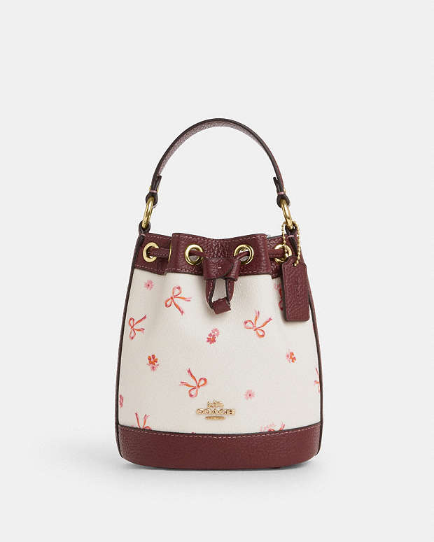 COACH® GB | Dempsey Drawstring Bucket Bag 15 With Bow Print