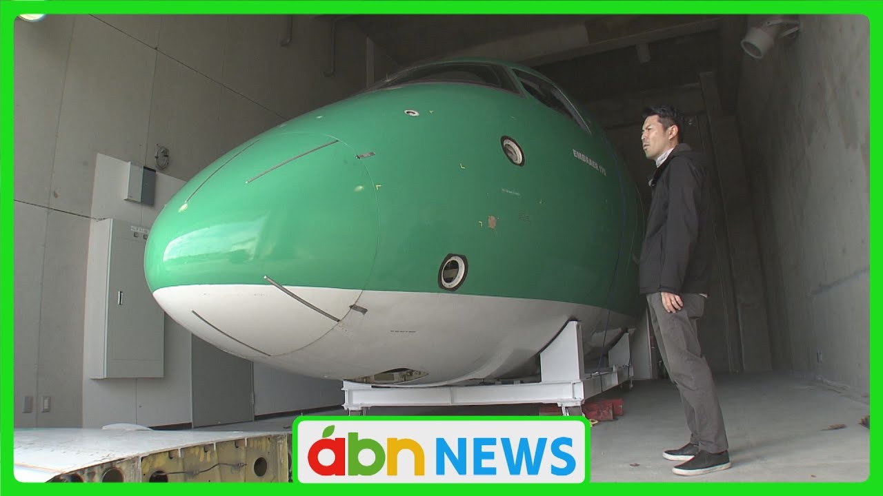 The nose of the retired green passenger plane 