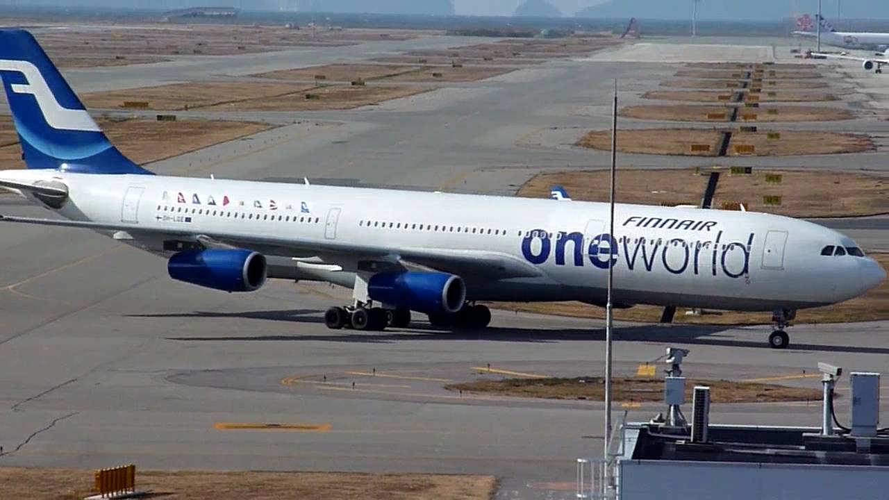 Oneworld livery] Finnair Airbus A340-300 (OH-LQE) landing at KIX