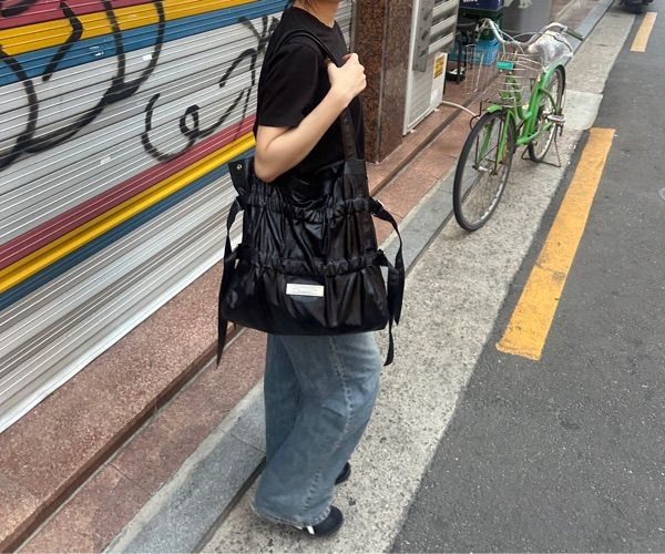 MUSINSA | MATIN KIM FAUX LEATHER SEASHELL BAG IN BLACK