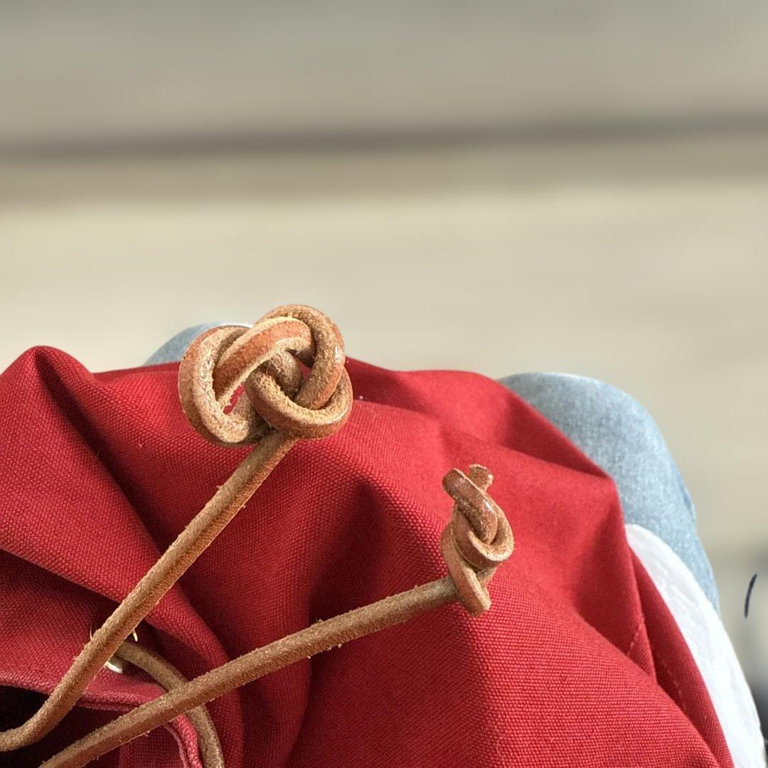 エルメス赤いキャンバスドローストリングショルダーバック