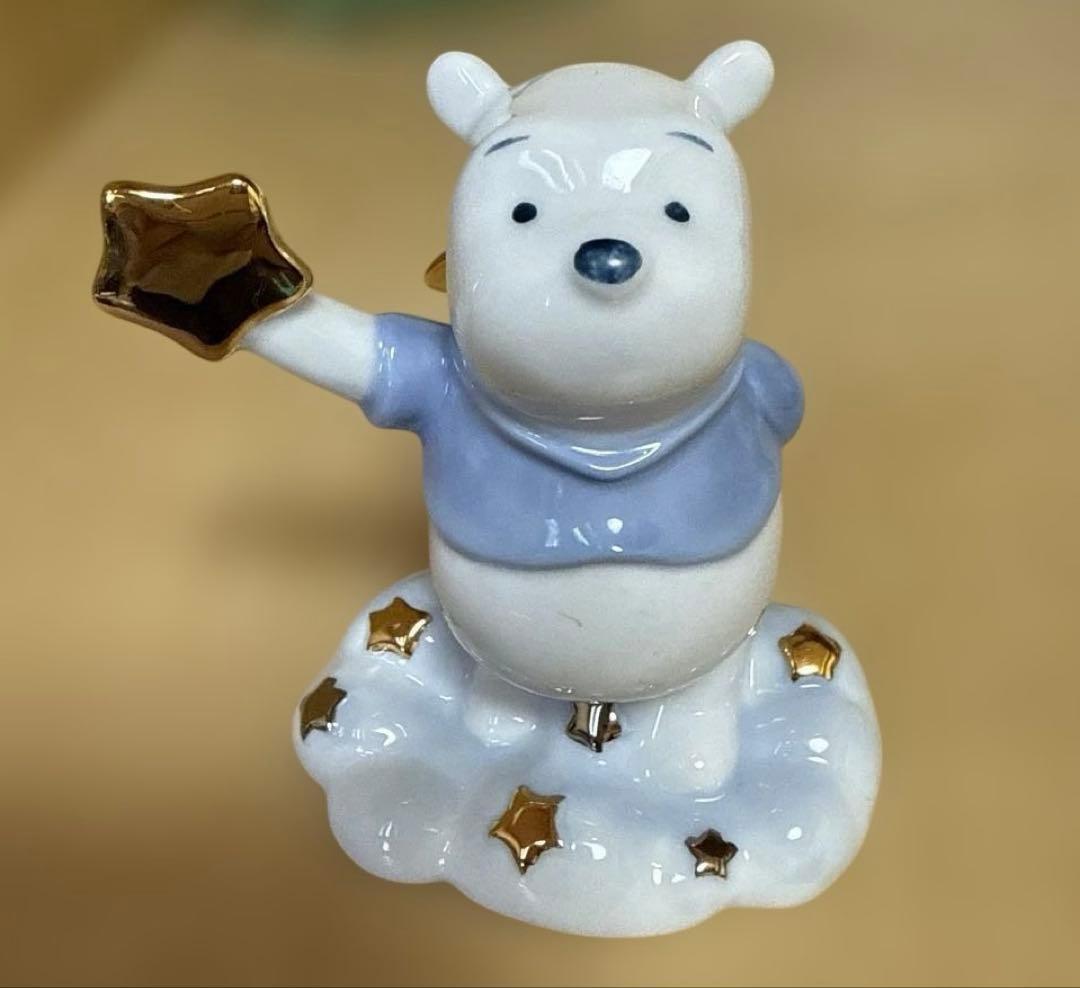星を持つクマのプーさんの陶器フィギュア - メルカリ