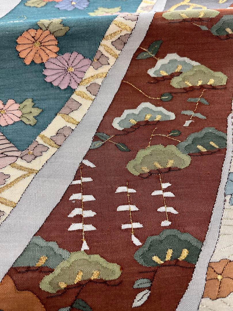 仕立て上がり新品袋帯 薄いグレーに鶴松花宝尽くしなどおめでたい柄