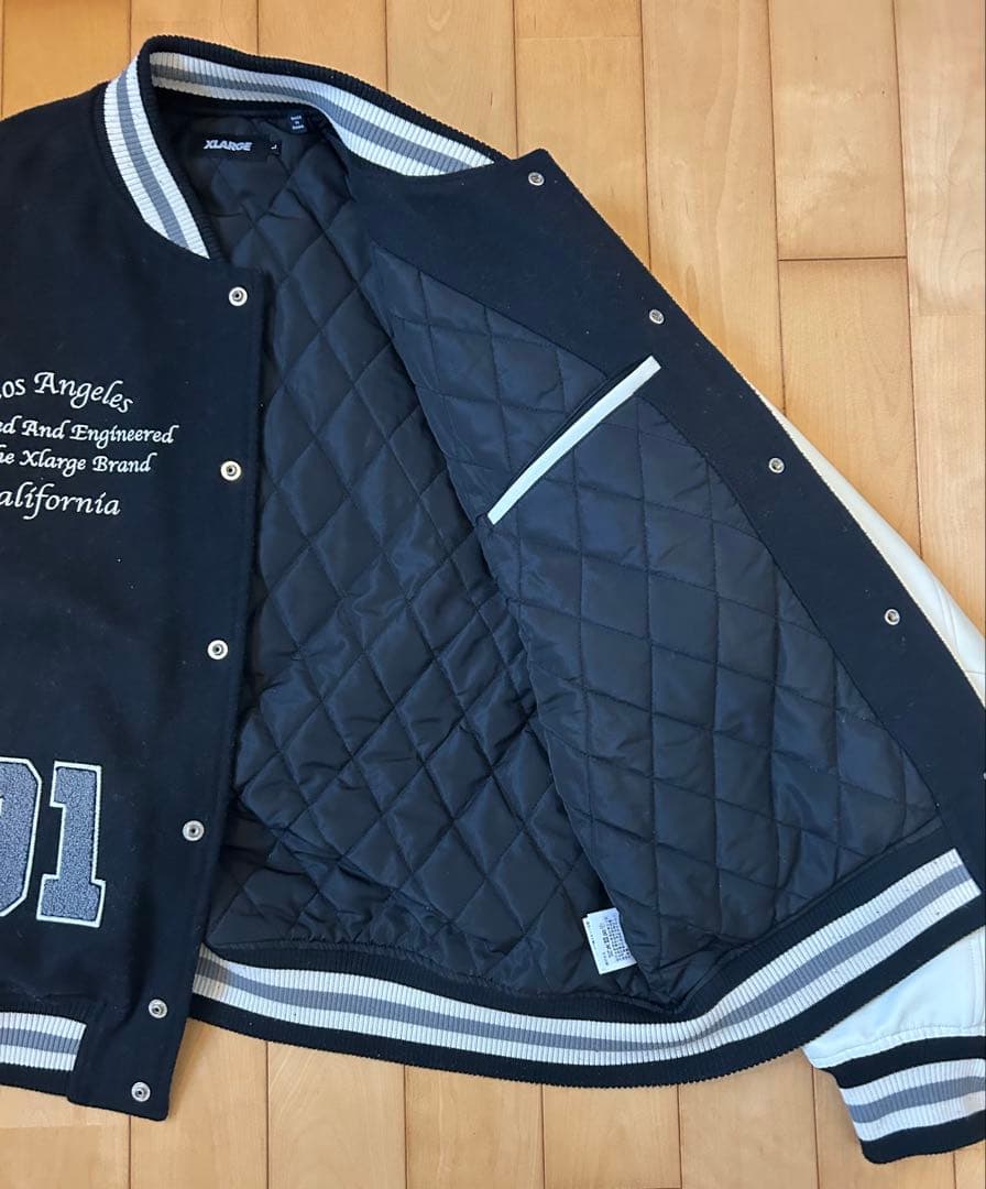 XLARGE スタジャン 黒/白ロゴ刺繍 - メルカリ