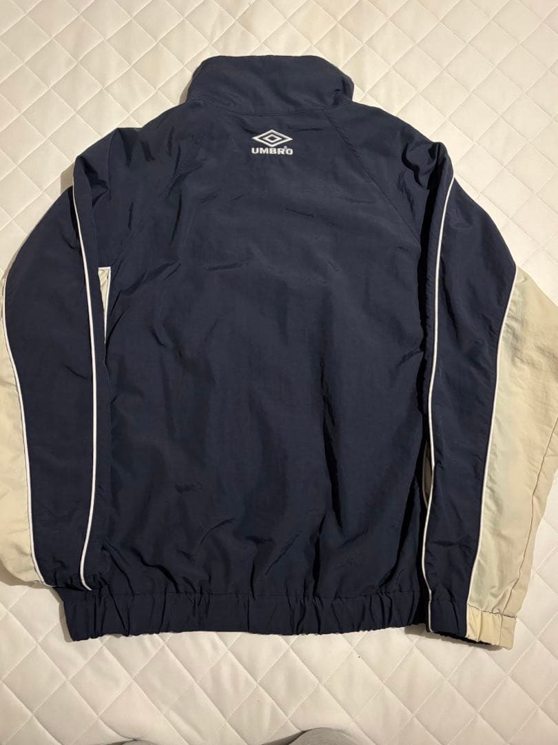 アンブロ トイマシーンコラボ ナイロンジャケット L - メルカリ