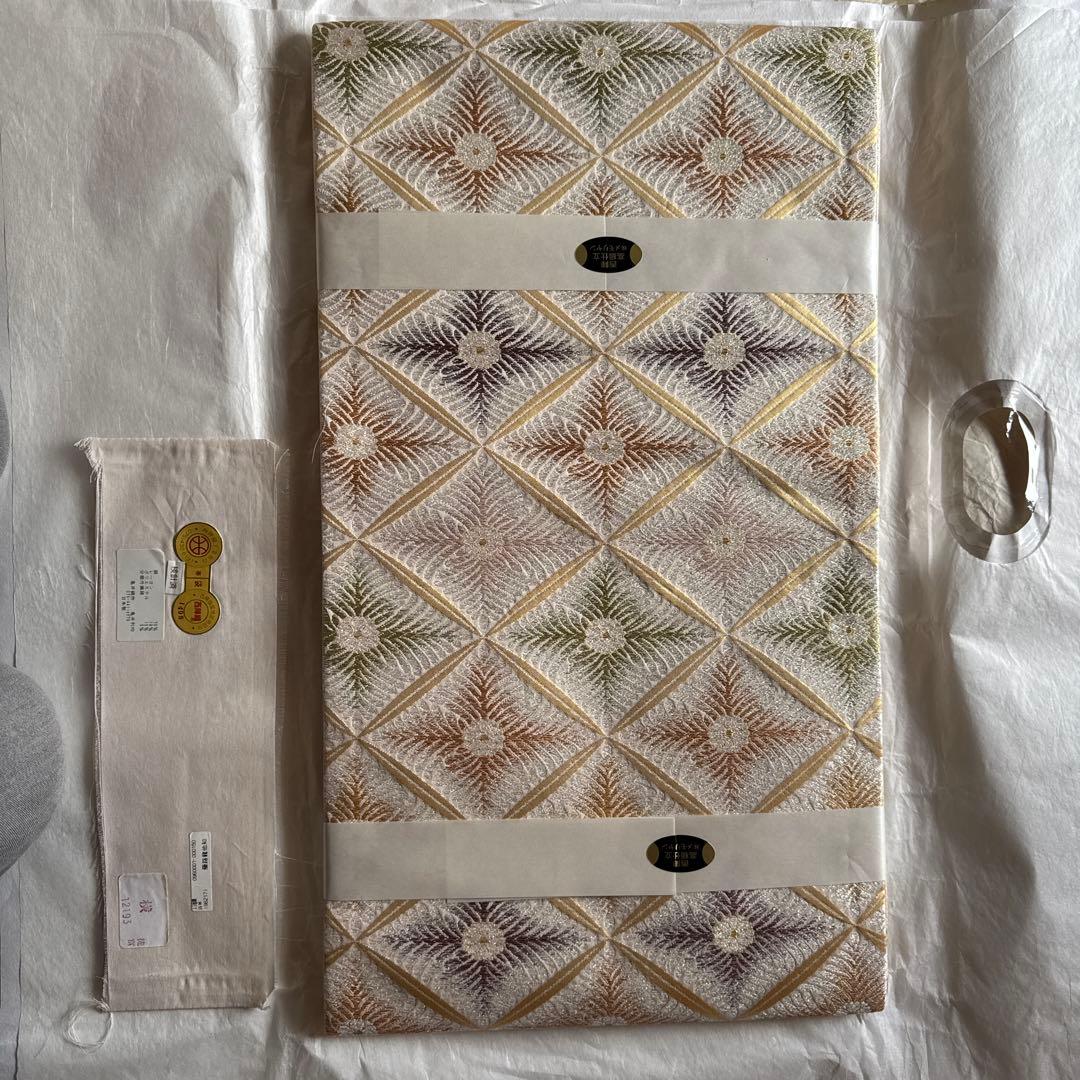 幾何学模様 袋帯 未使用品 幾何学模様 洒落 袋帯 黒地 オレンジ 白 約400cm 個性的 未使用 - メルカリ