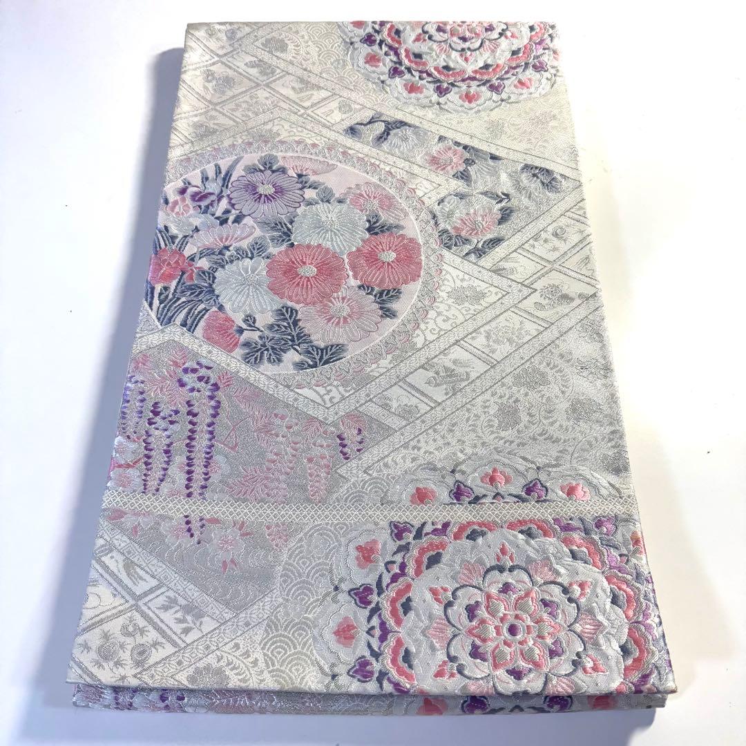 5k2780 袋帯 絹 唐織 プラチナ箔 正倉院文様 華文 銀色 白 ピンク 紫